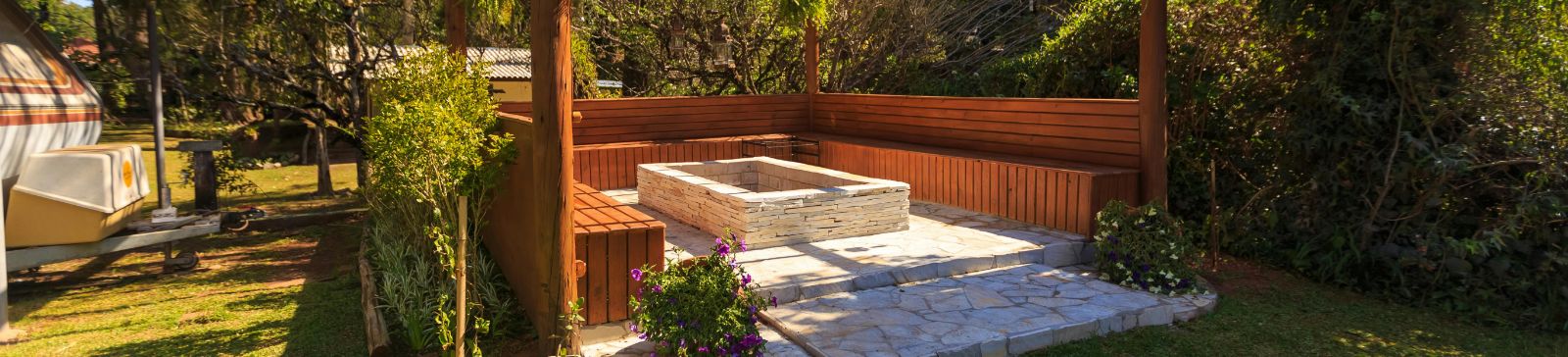 Outdoor fire pit surrounded by custom wooden benches inside South Pasadena gazebo
